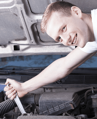 Mechanic Working on a Truck Engine